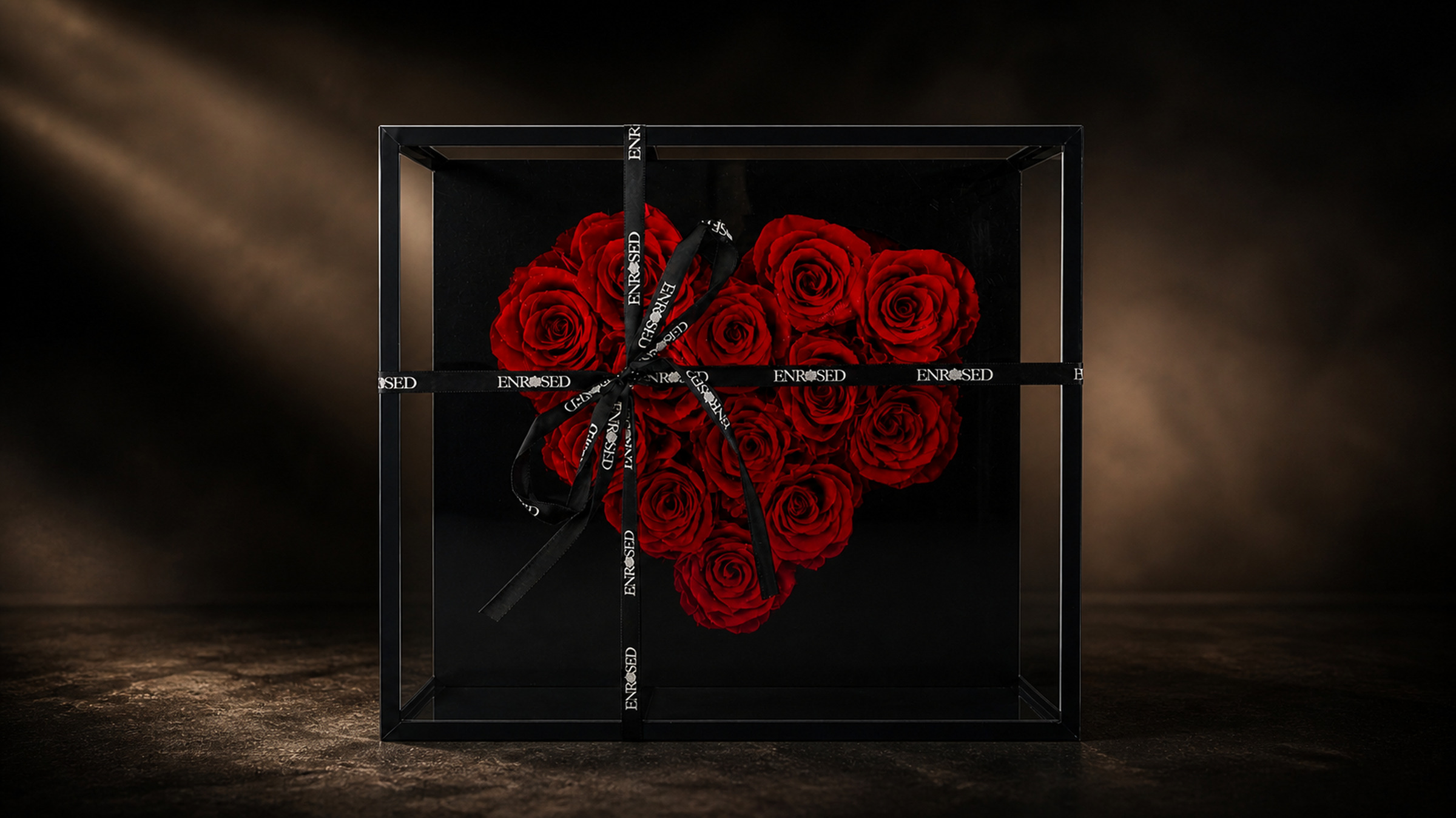 Glass flowerbox with a heart of red preserved roses